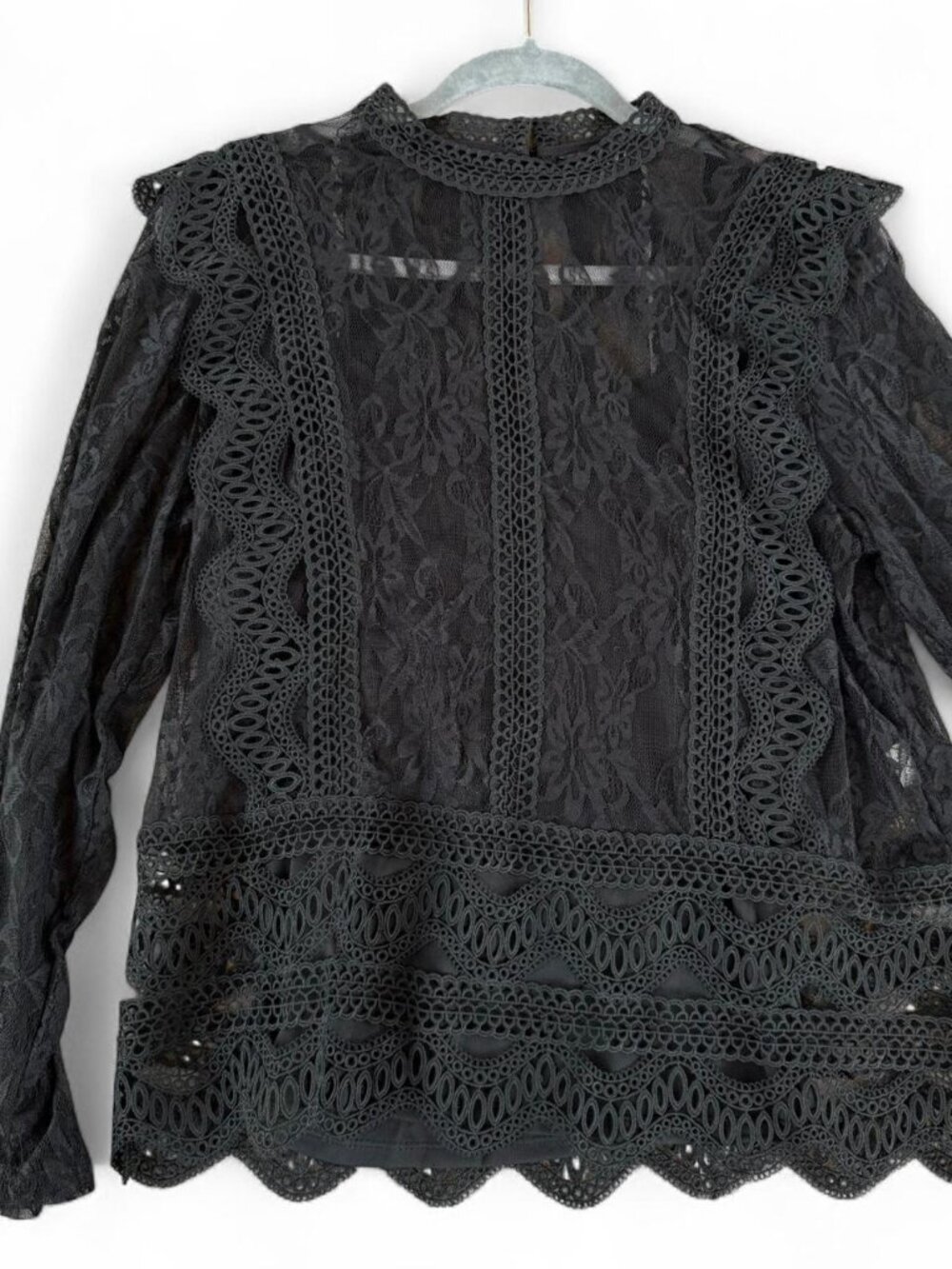 Black lace blouse with ruffles and buttons